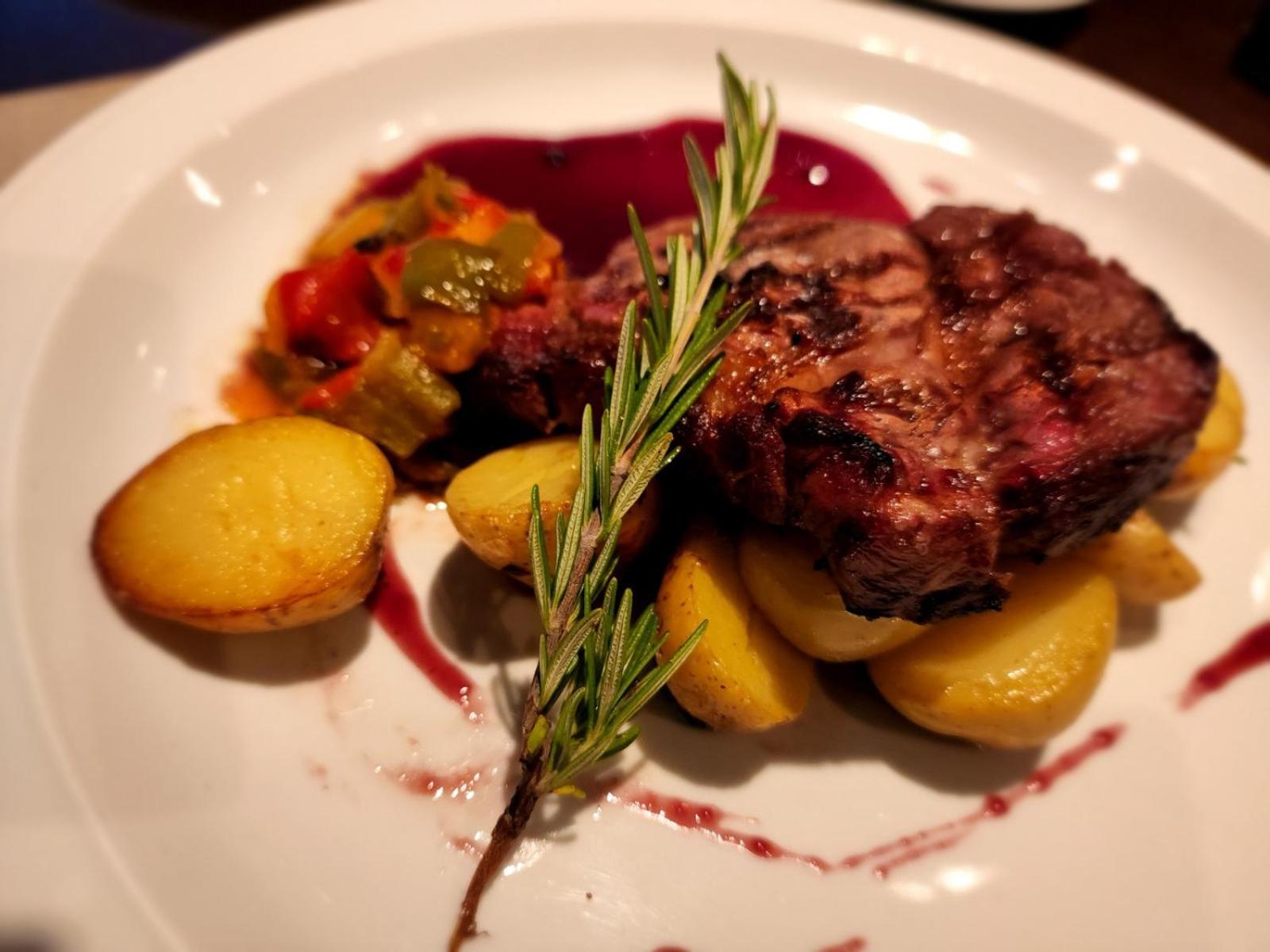 Regal Pacific Puerto Madero Hotel Буенос Айрес Екстериор снимка A steak prepared with a sprig of rosemary